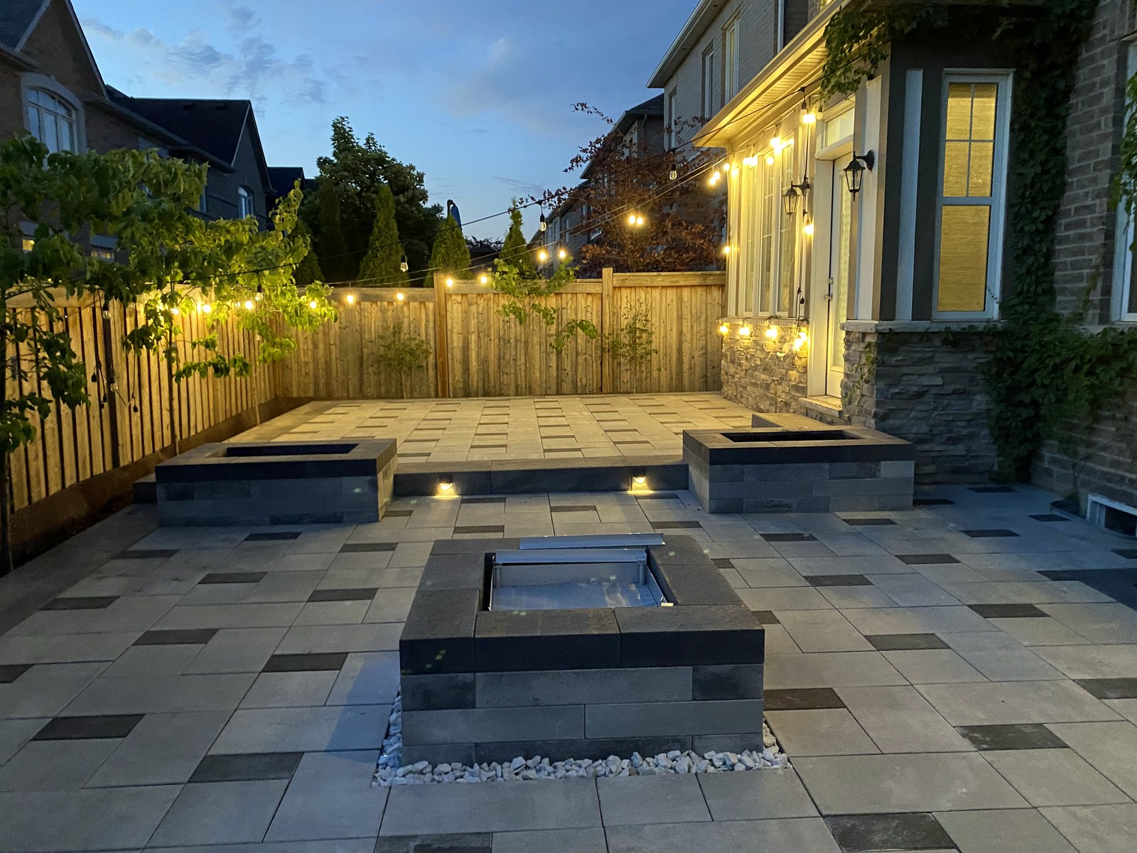 Completed Shuke patio with integrated landscape lighting